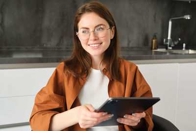 Young woman using mobile phone