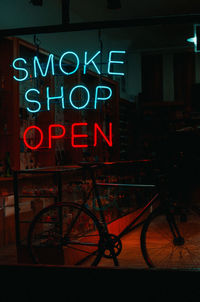 Information sign on illuminated city at night