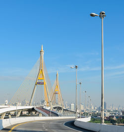 View of bridge and street against sky