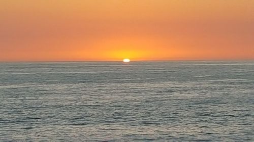 Scenic view of sea at sunset