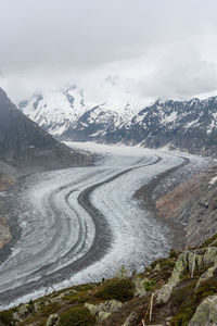 Snow covered roads amidst mountains