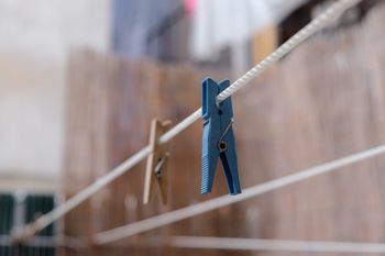Low angle view of clothespins hanging on clothesline