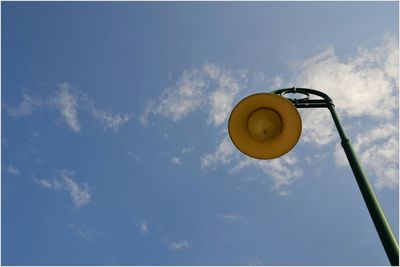 Low angle view of street light against sky