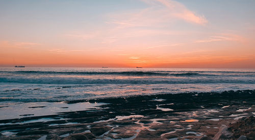 Scenic view of sea against sky during sunset