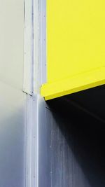 Close-up of yellow wall with closed door