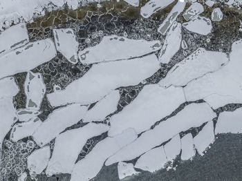 High angle view of frozen water on field