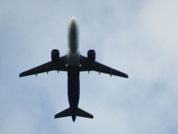 Low angle view of airplane against sky