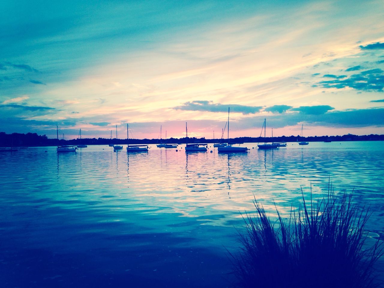 water, sky, nautical vessel, reflection, tranquil scene, tranquility, sunset, transportation, cloud - sky, boat, scenics, lake, moored, beauty in nature, waterfront, cloud, nature, mode of transport, blue, dusk