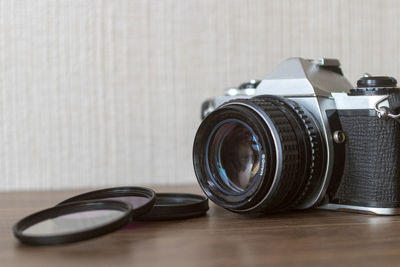 Close-up of camera on table