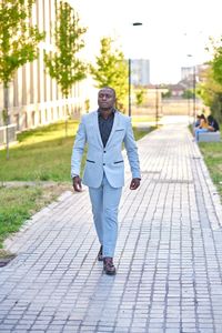 Stylish businessman walking down the street.