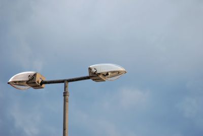 Low angle view of street light against sky