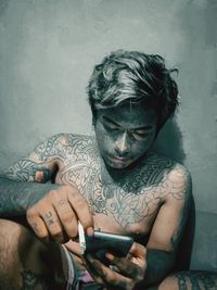 Young man using mobile phone