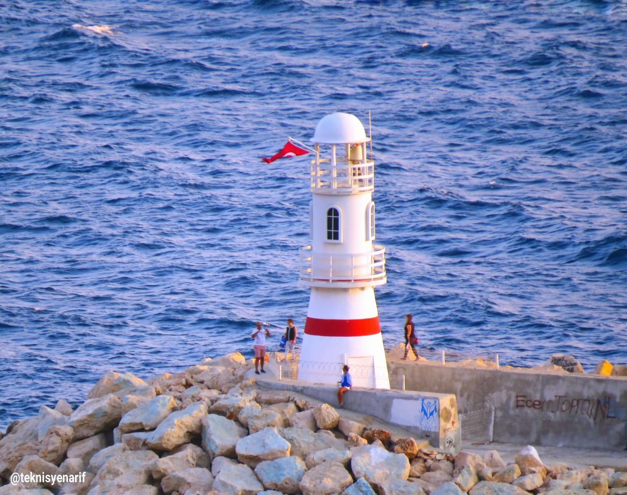 LIGHTHOUSE ON SEA SHORE