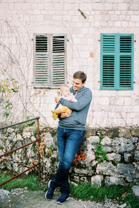 Portrait of young man using mobile phone