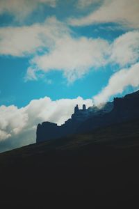 Low angle view of silhouette mountain against sky