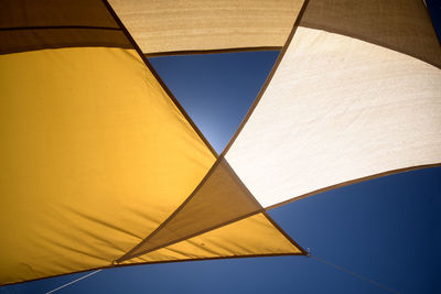 Blue sky and textile awning full sun