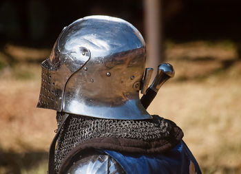 Close-up of old metal on field