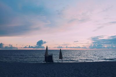 Scenic view of sea against sky at sunset