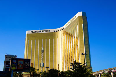 Low angle view of statue against blue sky