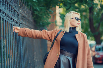 Young woman wearing long coat