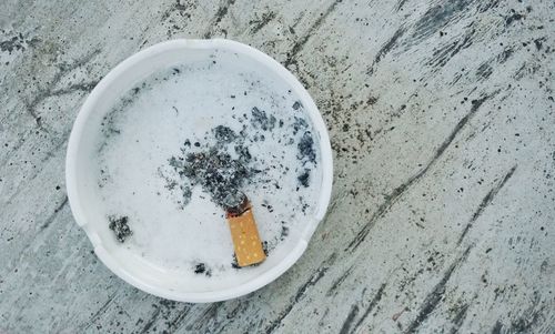 High angle view of cigarette on table