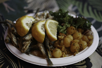 High angle view of fruits in plate on table