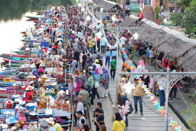 High angle view of people walking on street in city