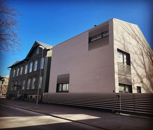 Low angle view of building against blue sky