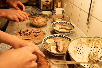 Midsection of person preparing food