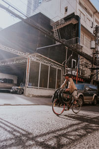 Bicycle on street against buildings in city