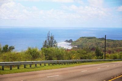 Road by sea against sky