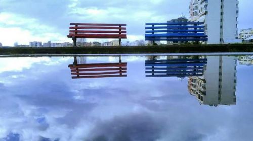Reflection of building in puddle