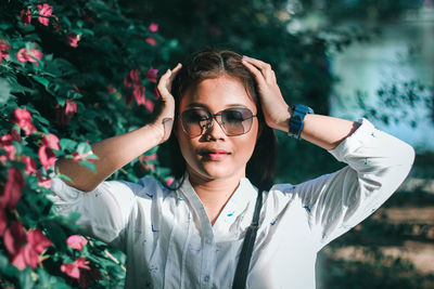 Portrait of young woman wearing sunglasses