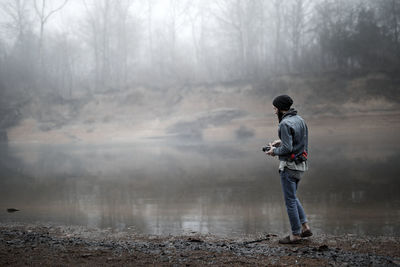 Full length of man standing at river