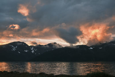 Scenic view of lake against sky during sunset