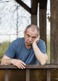 Portrait of man sitting outdoors