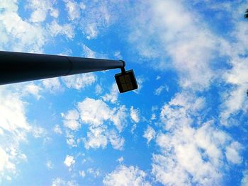 Low angle view of crane against blue sky