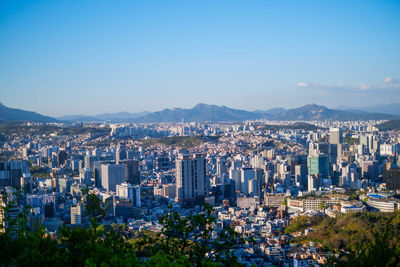 Aerial view of city buildings against sky