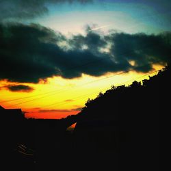 Low angle view of cloudy sky at sunset