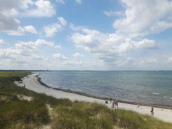 Scenic view of sea against cloudy sky