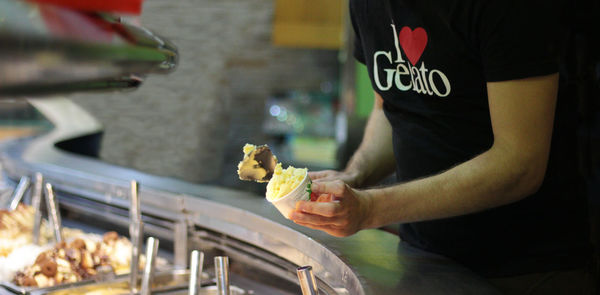 Close-up of man preparing food