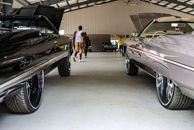 Rear view of people standing in car