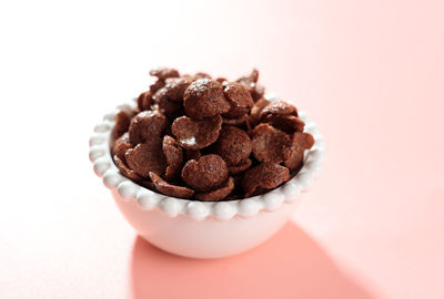 Close-up of dessert in bowl against white background