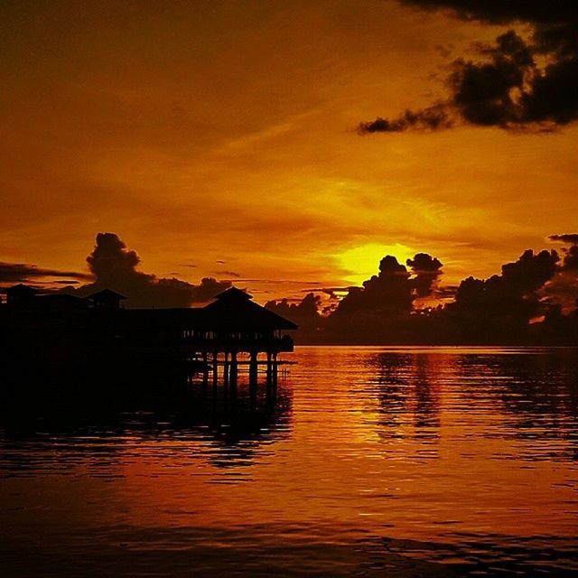 sunset, water, silhouette, scenics, tranquil scene, sky, tranquility, beauty in nature, orange color, reflection, waterfront, lake, idyllic, nature, mountain, cloud - sky, rippled, cloud, sea, dramatic sky