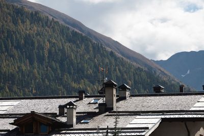 Houses and buildings against sky