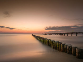 Pier over sea against sky during sunset at baltic sea
