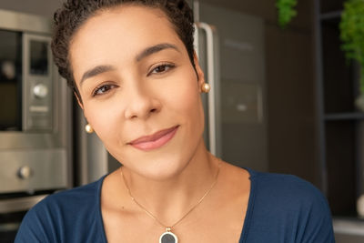 Close-up portrait of a smiling young woman