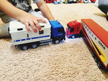 Boy playing with toy car