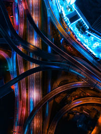 Light trails on bridge in city at night