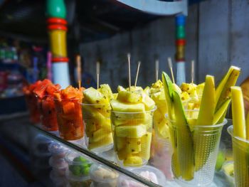 Close-up of fruits in glass on table, fresh vegetables fruit